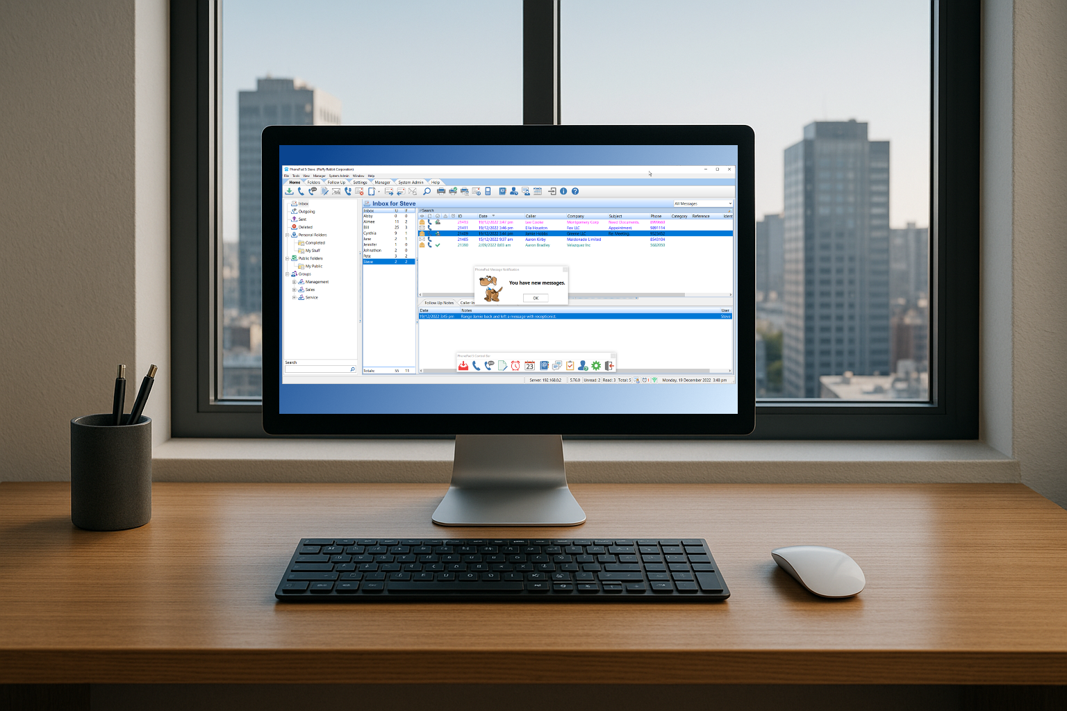 A clean desk with PhonePad showing on the computer monitor.